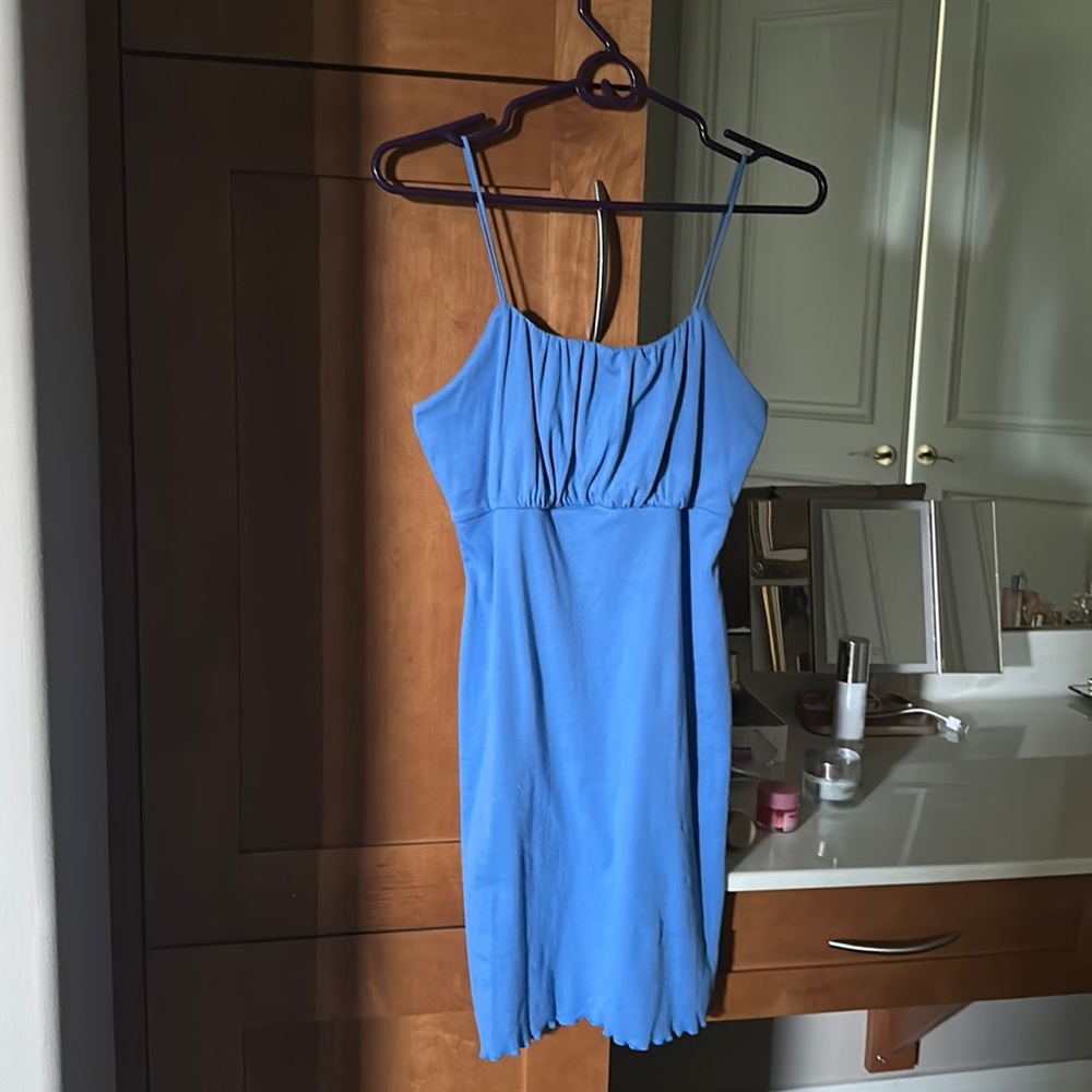 Woman’s blue bodycon summer dress.